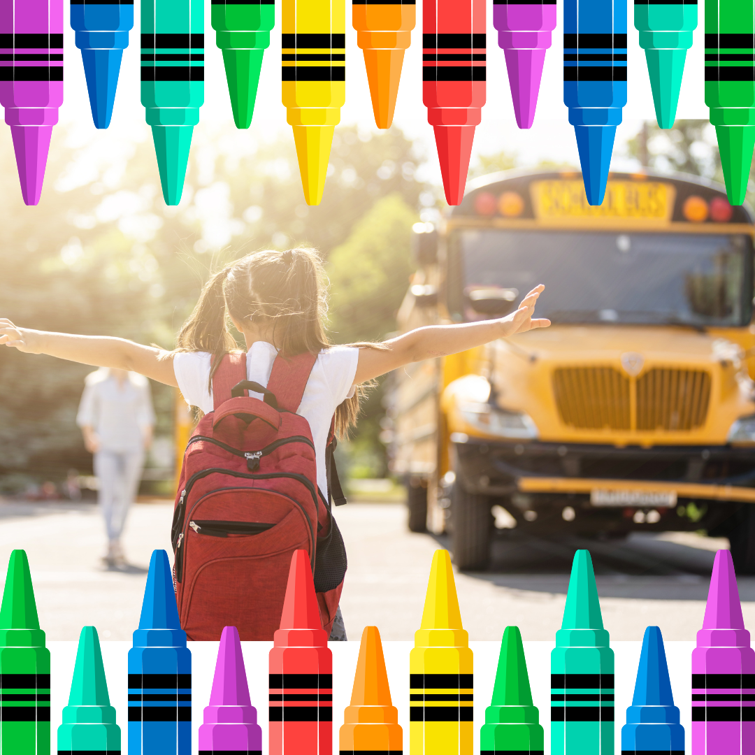 Small boy smiling while getting off of a school bus.